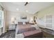 Main bedroom with a ceiling fan, ensuite bath, plush rug, and neutral tones for a relaxing retreat at 1720 Mariner Way, Tarpon Springs, FL 34689