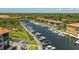 Picturesque marina with boat docks, surrounded by condominiums and lush landscaping at 1720 Mariner Way, Tarpon Springs, FL 34689