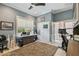 Home office with a ceiling fan, built in desk with a large window and plenty of natural light, and a plush rug at 1720 Mariner Way, Tarpon Springs, FL 34689