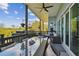 Inviting outdoor patio offers ample seating and dining areas, plus a picturesque view of the trees at 1720 Mariner Way, Tarpon Springs, FL 34689