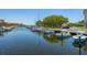 Scenic waterfront view with boat docks and lush landscaping creating a serene coastal ambiance at 1720 Mariner Way, Tarpon Springs, FL 34689