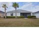 Backyard with screened-in porch and well manicured landscaping at 17541 Timberline Pkwy, Punta Gorda, FL 33982