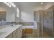 Bright bathroom featuring double vanity, soaking tub and glass-enclosed shower at 17541 Timberline Pkwy, Punta Gorda, FL 33982