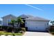 Charming single-Gathering home with a two-car garage, well-maintained landscaping, and a paved driveway at 17541 Timberline Pkwy, Punta Gorda, FL 33982