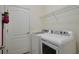 Bright laundry room featuring a modern washer and dryer set at 17541 Timberline Pkwy, Punta Gorda, FL 33982
