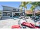 Large backyard featuring a swimming pool, outdoor kitchen, and stylish patio furniture at 17927 Bahama Isle Cir, Tampa, FL 33647