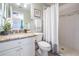 Cozy bathroom with a shower and granite countertop sink at 17927 Bahama Isle Cir, Tampa, FL 33647