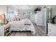 Inviting bedroom with a large window, ceiling fan, and wood floors at 17927 Bahama Isle Cir, Tampa, FL 33647