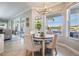 View of a well-lit breakfast nook near the sliding glass door that provides a view of the backyard at 17927 Bahama Isle Cir, Tampa, FL 33647
