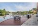 Community deck with a view of the lake, houses, and palm trees, perfect for relaxing outdoors at 17927 Bahama Isle Cir, Tampa, FL 33647