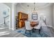 Dining room with wood table and seating for eight plus wine storage rack at 17927 Bahama Isle Cir, Tampa, FL 33647
