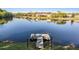 Picturesque backyard view of a private dock on a tranquil lake at 17927 Bahama Isle Cir, Tampa, FL 33647