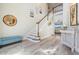 Bright, open foyer with staircase, wood floors, and stylish decor at 17927 Bahama Isle Cir, Tampa, FL 33647