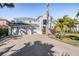 Charming two-story home with a three-car garage and a brick-paved driveway at 17927 Bahama Isle Cir, Tampa, FL 33647