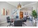 View of the game room table with archway views to stairs and dining room at 17927 Bahama Isle Cir, Tampa, FL 33647