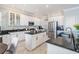 Spacious kitchen features a center island, stainless steel appliances, and white cabinetry at 17927 Bahama Isle Cir, Tampa, FL 33647