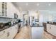 Spacious kitchen features a center island, black countertops, and white cabinetry at 17927 Bahama Isle Cir, Tampa, FL 33647