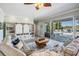 Spacious living room with pool views and custom built-in shelving, perfect for entertaining at 17927 Bahama Isle Cir, Tampa, FL 33647