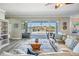 Beautiful living room with water views visible through the large sliding glass doors at 17927 Bahama Isle Cir, Tampa, FL 33647