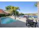 Relaxing pool with lake view, patio seating, and lush tropical landscaping at 17927 Bahama Isle Cir, Tampa, FL 33647