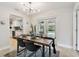 Dining area with seamless access to the pool area and updated kitchen at 1870 Wateroak W Dr, Clearwater, FL 33764