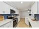 Bright kitchen featuring updated appliances, counter tops, and a sleek backsplash at 1870 Wateroak W Dr, Clearwater, FL 33764