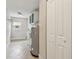 A clean laundry room is equipped with a water heater, shelving, and a window at 1870 Wateroak W Dr, Clearwater, FL 33764