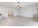 Spacious living area with neutral tile flooring throughout the open floor plan at 18981 Alfaro Loop, Spring Hill, FL 34610