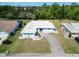 Ariel view of well-maintained property featuring manicured lawn and brick-paved driveway at 1929 New Bedford Dr, Sun City Center, FL 33573