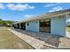 Exterior showcasing the sliding doors leading to the patio and backyard at 1929 New Bedford Dr, Sun City Center, FL 33573