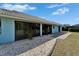 Large windows offer great light, as does the paved patio at 1929 New Bedford Dr, Sun City Center, FL 33573