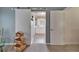 Bathroom with slider barn door leading to a vanity with floral patterned valance at 1929 New Bedford Dr, Sun City Center, FL 33573