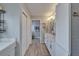 Bathroom featuring a double vanity, cabinets and view into the toilet and shower space at 1929 New Bedford Dr, Sun City Center, FL 33573