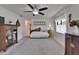 Bright bedroom featuring a daybed, a ceiling fan, and vintage decor at 1929 New Bedford Dr, Sun City Center, FL 33573