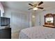 Bedroom with closet and dresser for storage at 1929 New Bedford Dr, Sun City Center, FL 33573