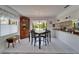 Eat-in kitchen with built-in hutch and large windows overlooking the backyard at 1929 New Bedford Dr, Sun City Center, FL 33573
