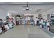 Spacious garage with ample shelving for storage and an overhead garage door at 1929 New Bedford Dr, Sun City Center, FL 33573