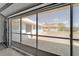 Garage space with screened doors allows for enjoying the outdoors while staying protected from insects at 1929 New Bedford Dr, Sun City Center, FL 33573