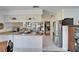 Kitchen with granite countertops, stainless appliances, and a view of the breakfast nook at 1929 New Bedford Dr, Sun City Center, FL 33573