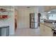 Bright kitchen with stainless steel refrigerator and plenty of cabinet storage at 1929 New Bedford Dr, Sun City Center, FL 33573