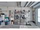 Well-organized laundry room features modern washer and dryer with ample storage and utility sink at 1929 New Bedford Dr, Sun City Center, FL 33573