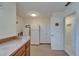 Laundry room area with additional storage at 1929 New Bedford Dr, Sun City Center, FL 33573
