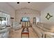Cozy living room featuring comfortable seating, stylish decor, and natural light at 1929 New Bedford Dr, Sun City Center, FL 33573