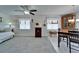 Cozy living room featuring neutral carpet, lots of natural light, and dining area adjacent to the living area at 1929 New Bedford Dr, Sun City Center, FL 33573