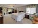 Spacious bedroom with a ceiling fan, large windows, walk in closet and traditional furnishings at 1929 New Bedford Dr, Sun City Center, FL 33573