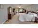 Light-filled main bedroom boasts ample space, a ceiling fan and traditional furnishings for a relaxed atmosphere at 1929 New Bedford Dr, Sun City Center, FL 33573
