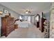 Expansive main bedroom has a ceiling fan and features traditional furniture and an ensuite bathroom at 1929 New Bedford Dr, Sun City Center, FL 33573