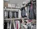 Organized walk-in closet featuring shelving and rods for ample storage at 1929 New Bedford Dr, Sun City Center, FL 33573