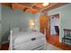 Comfortable bedroom featuring light blue walls, hardwood floors, and natural light at 20926 Ragan Ln, Land O Lakes, FL 34638