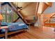 Bedroom featuring exposed beams, a queen size bed and a wall of windows with lush views at 20926 Ragan Ln, Land O Lakes, FL 34638